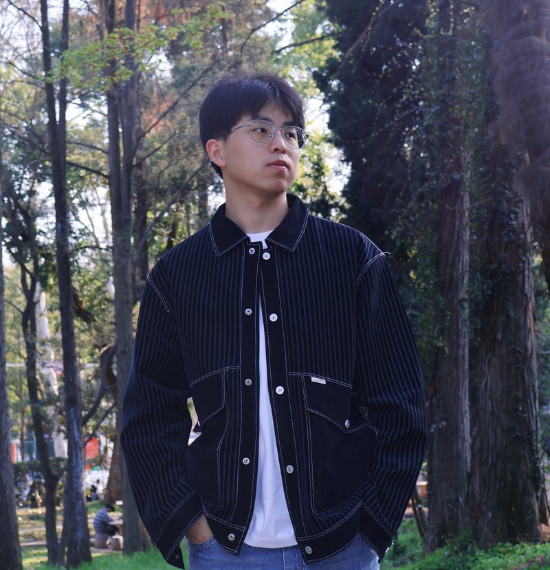 Nan Yan outdoors among trees